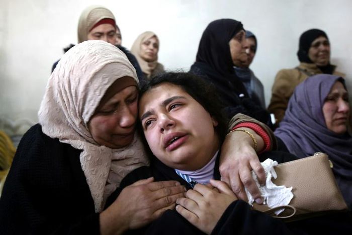 Mourners attend the funeral of 17-year-old Sajid Muzher, who the Palestinian health ministry said was killed by Israeli forces during clashes in the West Bank