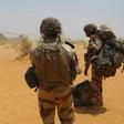 Heat and dust: Two French soldiers wait to board a British Chinook helicopter near the new French military base at Gossi, east-central Mali
