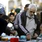 Economy under pressure: Iranian tourists exchange Iranian Rial banknotes in the central Iraqi shrine city of Najaf