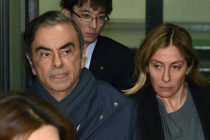 Carole Ghosn (R) wants the French government to do more for her husband