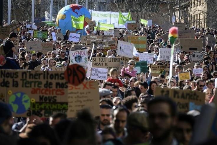 Marches calling for government action on climate change, such as this one in Lyon, took place across France