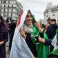 Protesters wear the Algerian national flag in the capital Algiers on March 8, 2019