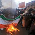 Pakistani protesters burn an Indian national flag during a protest in Peshawar on February 26, 2019, following the Indian Air Force (IAF) strike launched on a Jaish-e-Mohammad (JeM) camp at Balakot.
