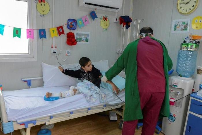A patient receives treatment at the Doctors Without Borders (MSF) hospital in Iraq's Mosul