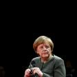 Chancellor Angela Merkel said Germany would lift defence spending but not at the cost of development aid, rejecting US criticism