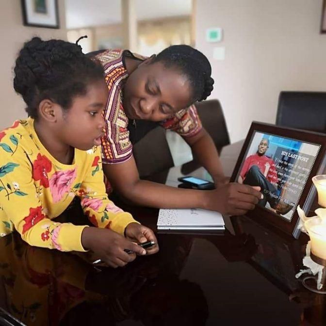 Pius Adesanmi's wife, Muyiwa, breaks the news of her husband's death to their daughter, Tise. [Twitter]