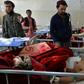 Afghan victims receive medical treatment at a hospital following a suicide attack on a private construction company in Jalalabad Wednesday