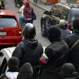 Masked members of a pro-government colectivo cell attend a rally in Caracas on January 7, 2019