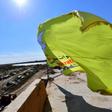 The yellow flag of the Kurdish-led Syrian Democratic Forces billows over the Islamic State group's last redoubt of Baghouz after the jihadist black flag is finally torn down