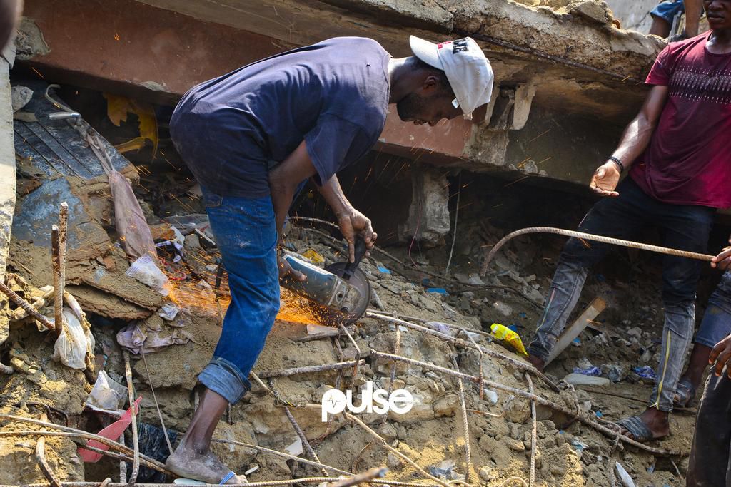 A man uses an angle grinder to cut through an iron rod (Pulse)