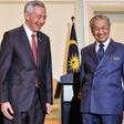 Malaysia's Prime Minister Mahathir Mohamad (R) met his Singaporean counterpart Lee Hsien Loong held a joint press conference in Putrajaya