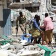 A victim is removed from the Maka Al-Mukarama hotel in Mogadishu on March 1, 2019 following a 24-hour seige by Al-Shabaab jihadists