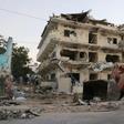 A heavy equipment loader cleans debris outside the Maka Al-Mukarama hotel in the Somali capital Mogadishu, one day after a deadly suicide car bombing