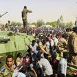 Sudanese soldiers stand guard on armoured military vehicles as demonstrators continue their protest against the regime near army headquarters in the Sudanese capital Khartoum on April 11, 2019