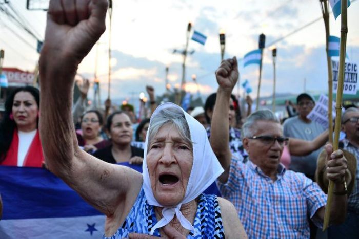 Protestors march to demand the resignation of Honduran President Juan Orlando Hernandez