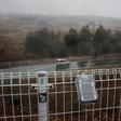 A geiger counter attached to a fence near the Daiichi power plant measures radiation in Okuma town, Fukushima prefecture