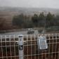 A geiger counter attached to a fence near the Daiichi power plant measures radiation in Okuma town, Fukushima prefecture