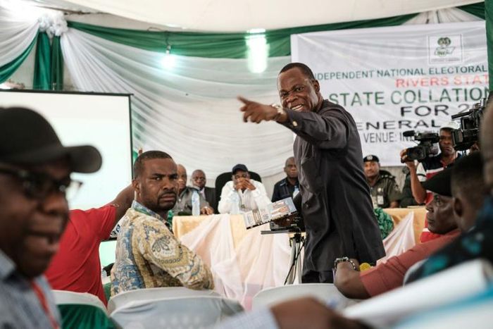 Tension: Party representatives argue over the vote count at a collation centre at Port Harcourt, Nigeria's oil hub