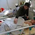 Afghan victims receive medical treatment at a hospital following a suicide attack on a private construction company in Jalalabad