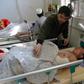 Afghan victims receive medical treatment at a hospital following a suicide attack on a private construction company in Jalalabad