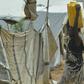 A woman carries a container of water at a UN-protected site in Juba that offers shelter to civilians fleeing fighting