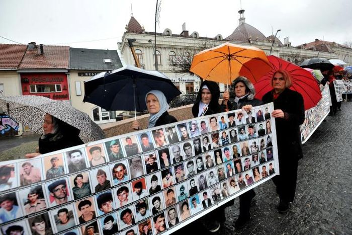 People gathered in the centre of the northeastern Bosnian city of Tuzla to demand justice over the Srebrenica killings