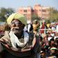 Smartphone users in emerging nations such as India, where this farmer is seen at a rally, say they get benefits from the devices but worry about the impact of digital technology on children