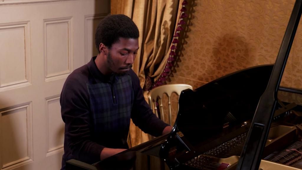 Made Kuti playing the piano [Dailyadvent]