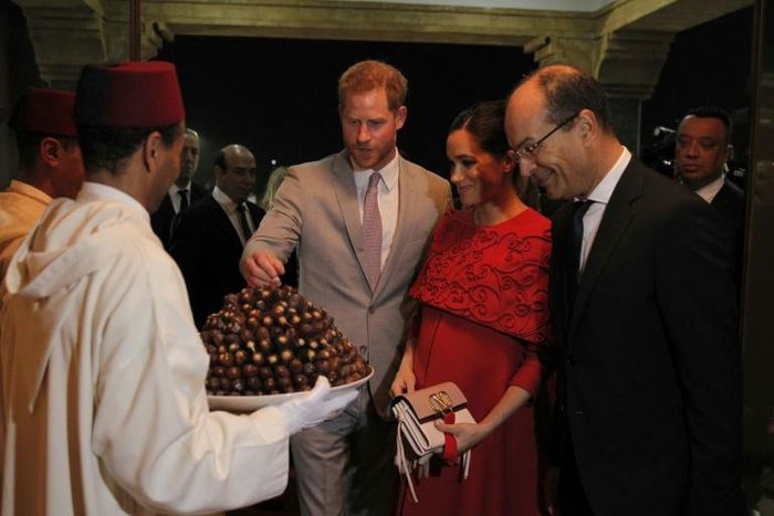 Prince Harry and Meghan were given a traditional welcome with a tray of dates on their arrival in Morocco