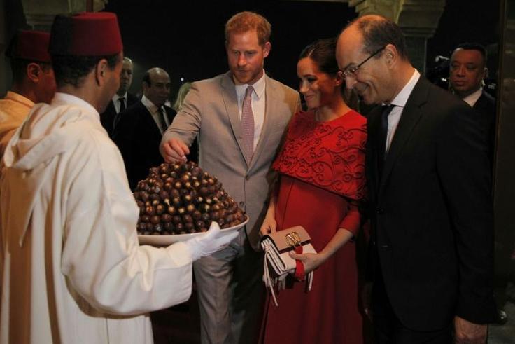 Prince Harry and Meghan were given a traditional welcome with a tray of dates on their arrival in Morocco