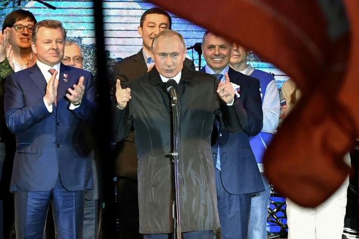 Russian President Vladimir Putin speaks at a concert for the fifth anniversary of Russia's annexation of Crimea, Simferopol, March 18, 2019. EU states Estonia and Poland said they blocked a Russian training ship from their waters because some on board ...