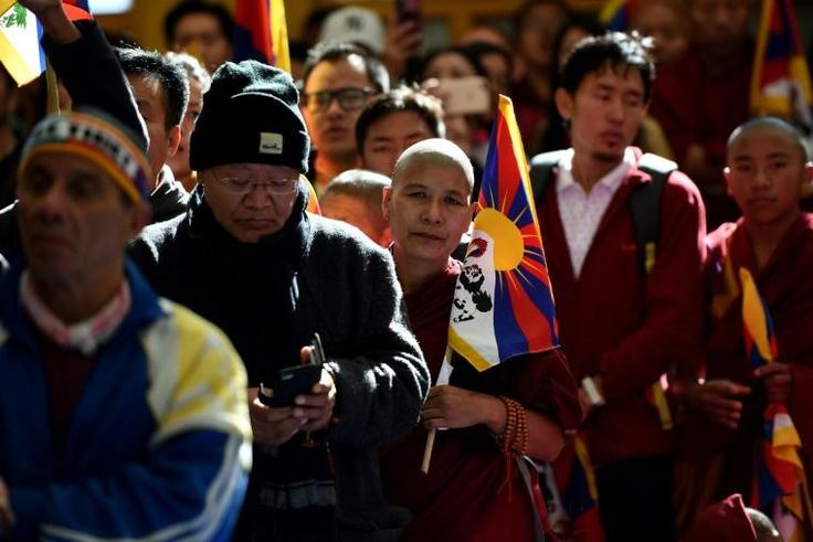 Supporters of the Dalai Lama chanted and prayed at the Buddhist shrine in mountainous Dharamsala - home to Tibet's government in exile