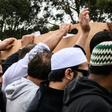 Mourners carry the coffin of Mohammed Daoud Nabi, 71, who unknowingly opened the door to his killer at the city's Al Noor mosque, reportedly welcoming him with the words 'Hello Brother'
