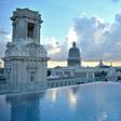 A tourist stands by the rooftop swimming pool at the Gran Hotel Manzana in Havana -- one of many luxury properties attracting tourists in Cuba