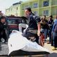 Relatives mourn over the body of a passenger who died in a ferry accident while crossing the Tigris river outside a morgue in the northern Iraqi city of Mosul