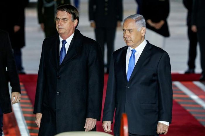 Brazilian President Jair Bolsonaro (L) was greeted on arrival in Israel by Prime Minister Benjamin Netanyahu