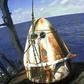 This still image taken from NASA TV shows SpaceX's Crew Dragon spacecraft safely aboard the company's recovery vessel following splashdown on March 8, 2019
