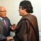 Zuma, left, pictured with Kadhafi on May 30 2011, when he made a one-day visit to Tripoli as head of an African Union delegation mediating in the Libyan crisis. Zuma has denied a newspaper report that he was given $30 million by Kadhafi for 'safe keepi...