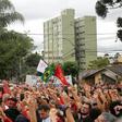 Supporters of former Brazilian president Luiz Inacio Lula da Silva rally outside his cell on April 7, 2019 to mark his first year in prison