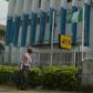 A man walk past a Western Union money transfer and Moneygram in Benin City, Nigeria