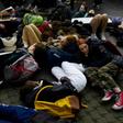 Students at the United Nations in New York stage a "die-in," lying sprawled on the pavement to protest the lethal consequences of global warming
