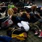Students at the United Nations in New York stage a "die-in," lying sprawled on the pavement to protest the lethal consequences of global warming