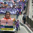 Activists push a carriage with an effigy of Philippines' President Rodrigo Duterte as they march toward Malacanang palace to commemorate International Women's Day in Manila