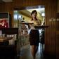 The Green Leaf Coffee Shop's 1970s-style decor is predominantly brown, and pictures of the Kimilsungia and Kimjongilia flowers named for North Korea's rulers are on show