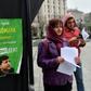 Party suporters hand out leaflets to passersby outside of the incumbent President Petro Poroshenko's campaigning tent, decorated with signs that read 'Stop' or 'Ze', a pun on the name of rival candidate comedian Volodymyr Zelensky
