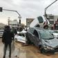 Cars pilled up in a street of the southern Iranian city of Shiraz where at least 11 people were killed and 68 injured in flooding