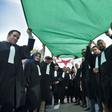 Algerian lawyers and journalists take part in a protest against their ailing president's bid for a fifth term in power, in Algiers