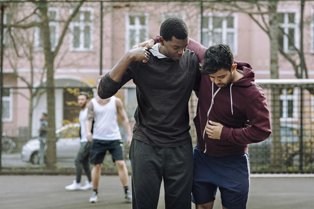 Helping Injured Team Mate