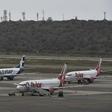 Commercial planes sit on the tarmac at Simon Bolivar International Airport in Maiquetia, in the state of Vargas, northern Venezuela, on March 8, 2019 during the worst power outage in the country's history