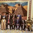Sudan's President Omar al-Bashir (6th-L, front) poses for a group photo with members of his new 20-member cabinet as they take the oath of office at the presidential palace in Khartoum